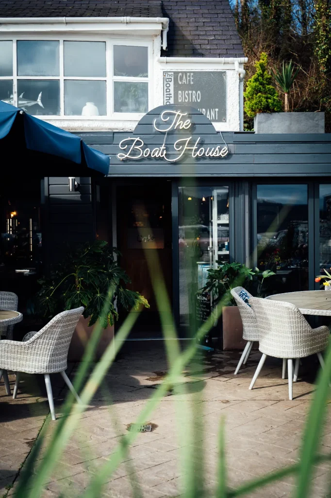 The Boathouse café and bistro signage at Red Wharf Bay, Anglesey. Beachfront exterior shot by Mona Digital.