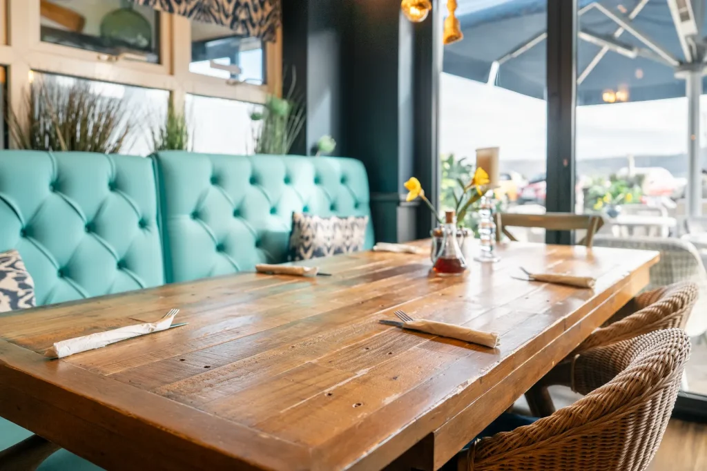 The Boathouse signature turquoise booth seating, Red Wharf Bay, Anglesey. Interior detail shot by Mona Digital.