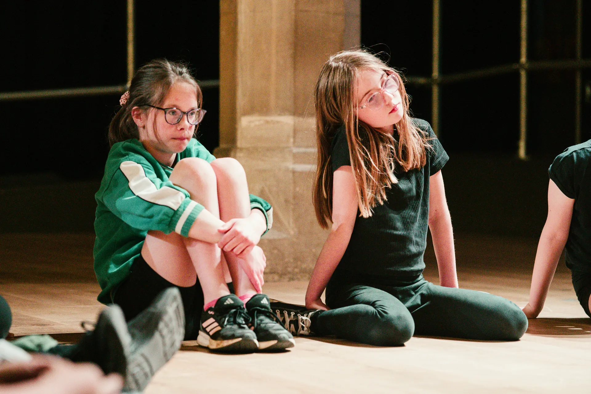 Cwmni Ifanc workshop moment — teenagers in physical theatre warm-up.