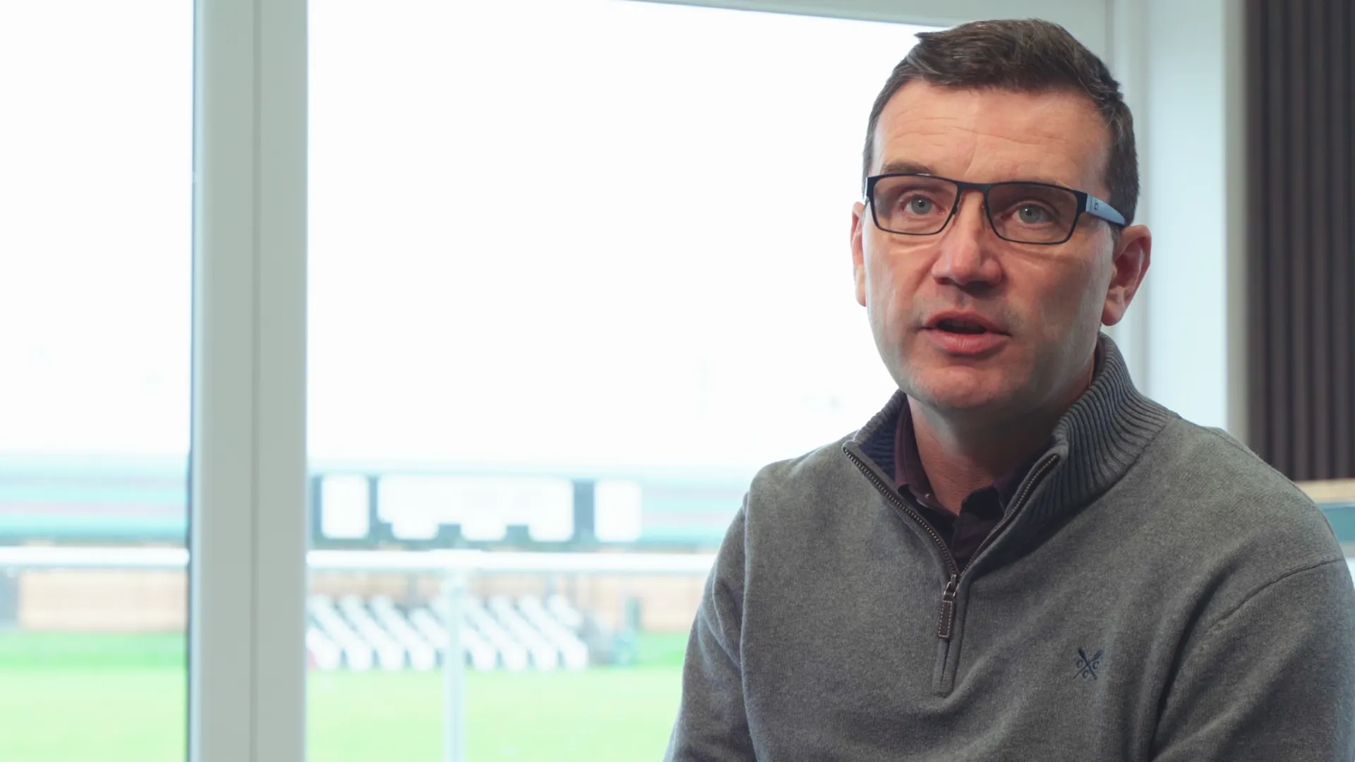 CPD Pwllheli club chairman interviewed in the new clubhouse with pitch behind — Menter Môn community film.