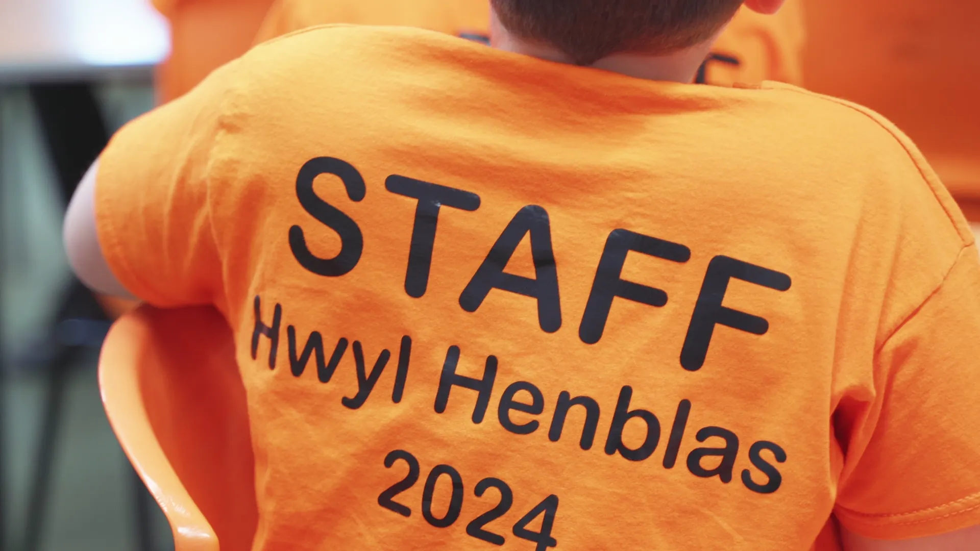 Close-up of a pupil's STAFF Hwyl Henblas 2024 t-shirt — primary school children running their own community gig in Llangristiolus, Anglesey.