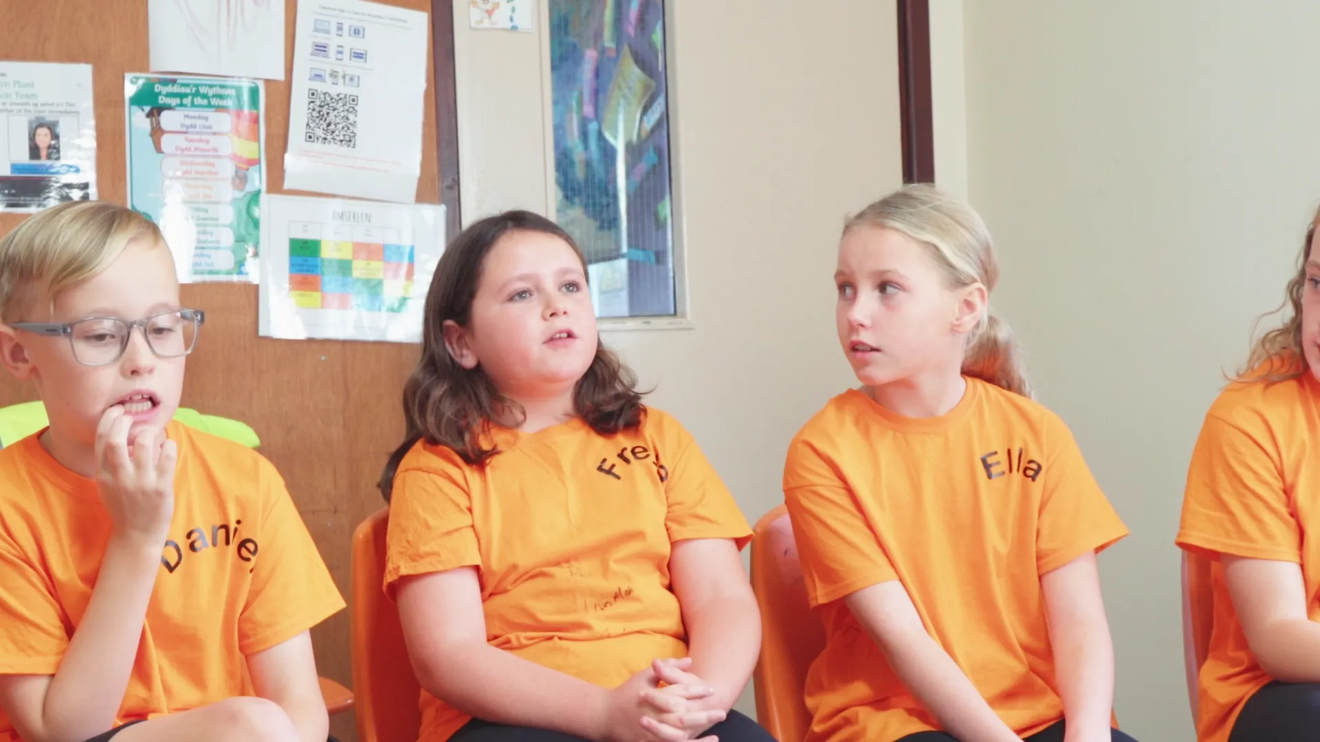 Three Ysgol Henblas pupils speaking on camera in the classroom about how they planned and budgeted Hwyl Henblas 2024 — Menter Môn film.